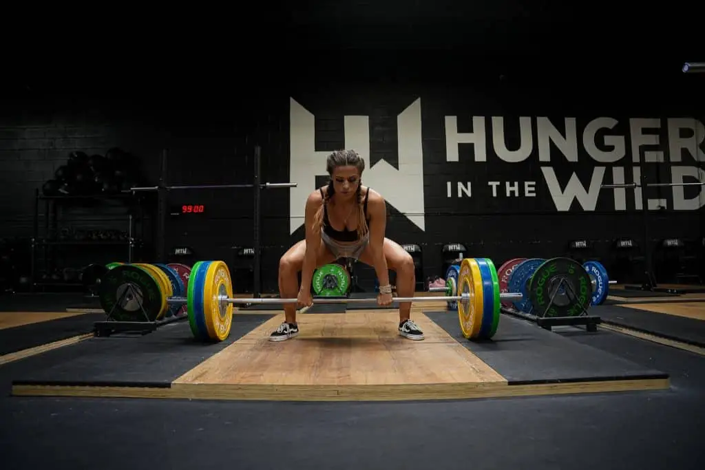 Performance Nutrition Woman lifting weights in gym