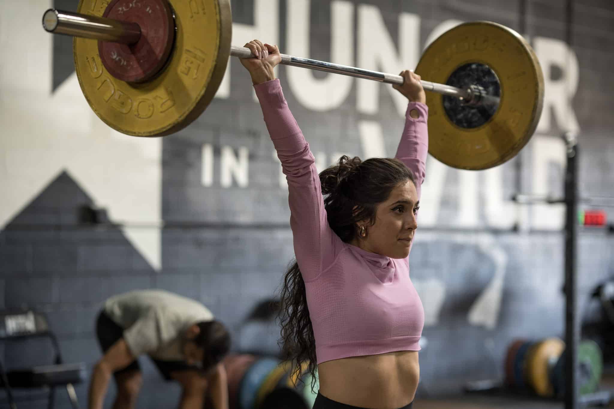 Why Strength Training Needs Its Own Dedicated Session Dedicated strength training session — athlete performing barbell squat at Hunger in the Wild Gym in Dallas