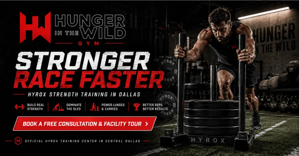 HYROX Strength Training in Dallas: How Real Strength Drives Race Performance HYROX athlete pushes a weighted sled across indoor turf at Hunger in the Wild Gym in Dallas, promoting strength-focused HYROX training and performance improvement.