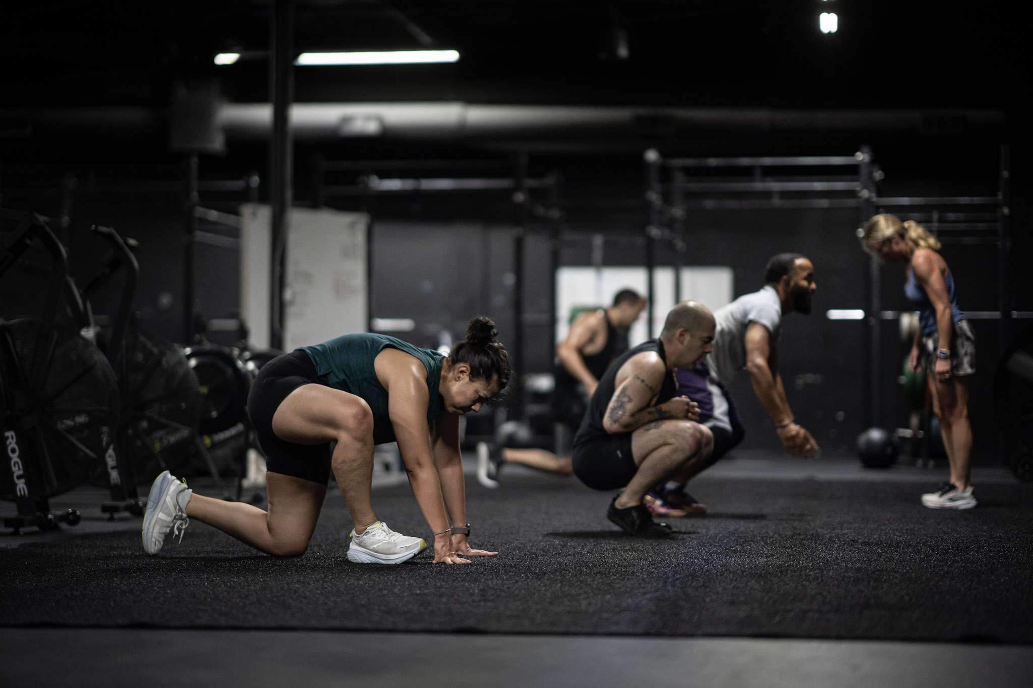 Group class working through burpees on the training floor during HYROX class at our Dallas gym