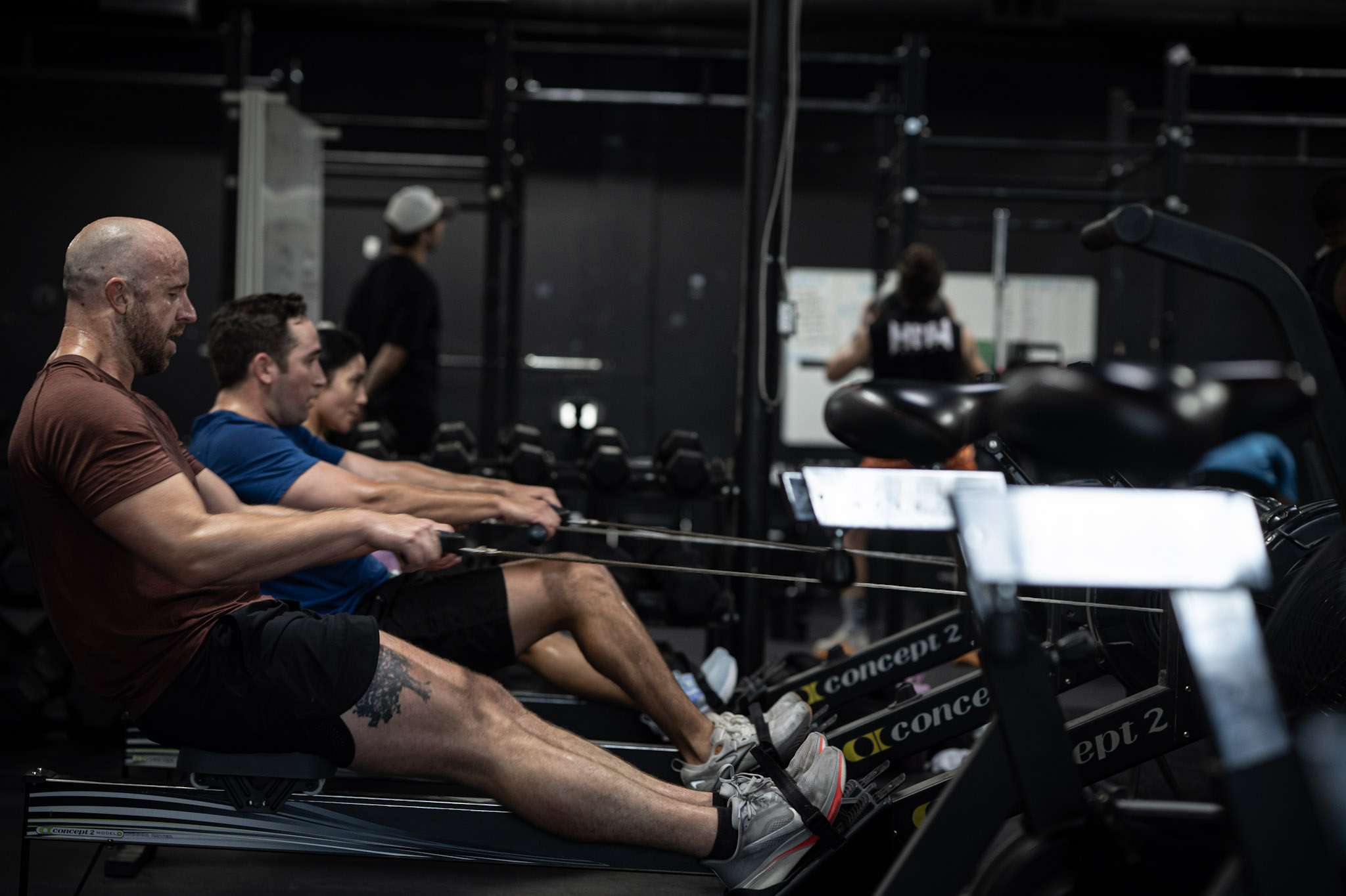 Athletes on Concept2 rowers during a conditioning class at Hunger in the Wild Gym in Dallas