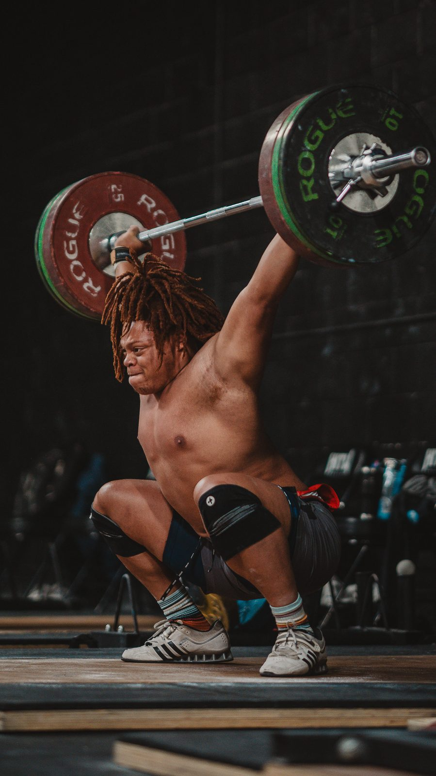 Athlete catching a snatch overhead at Hunger in the Wild Gym in Dallas