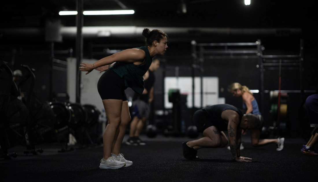 What Are the Best Gyms in Dallas? The Right Fit for Every Training Goal Athletes performing burpees together at Hunger in the Wild Gym.