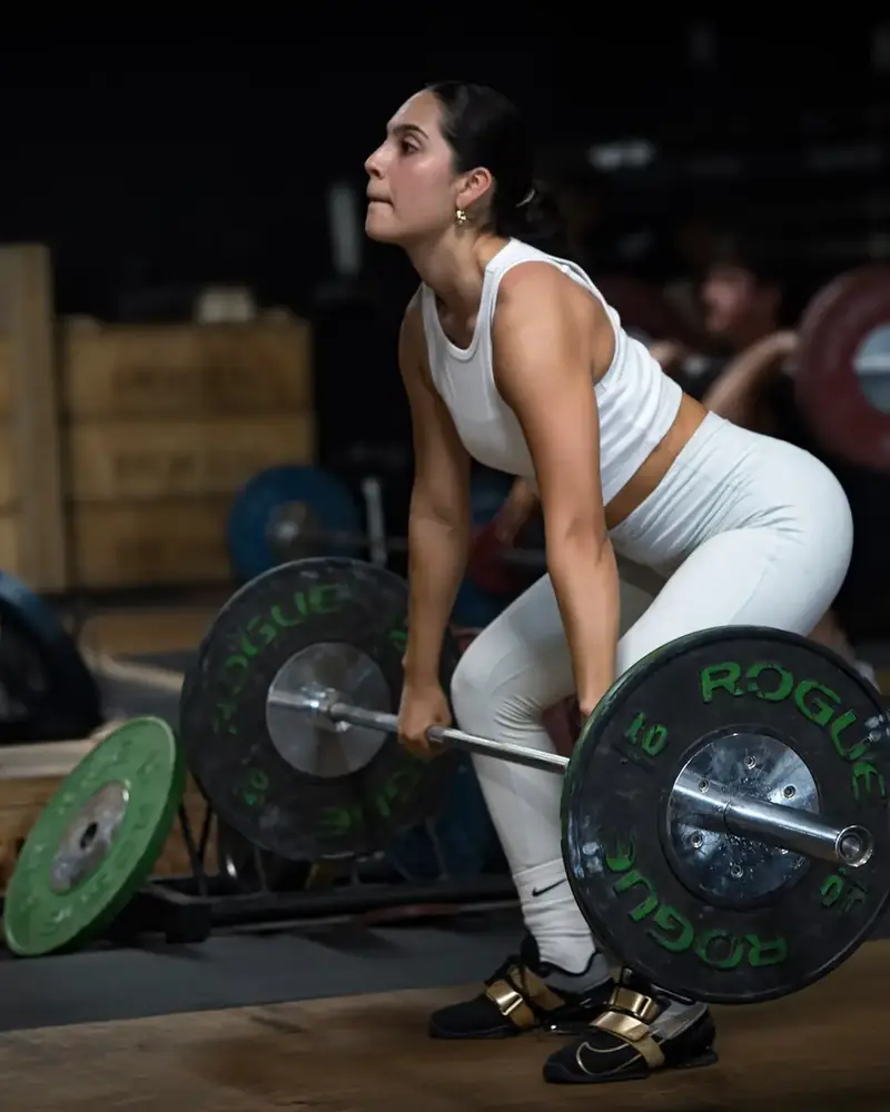 Lifter pulling a snatch on the platform at Hunger in the Wild